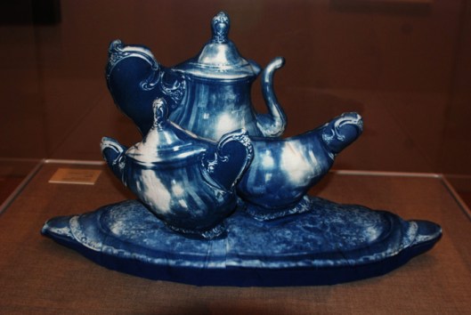Stuffed three dimensional fabric tea set by Catherine Jansen. "I photographed the tea set, blew up the negative to life size, made a cyanotype photogram on a piece of cloth, the stitched it together and stuffed it." Shared under a Creative Commons Attribution-Share Alike 2.0 Generic